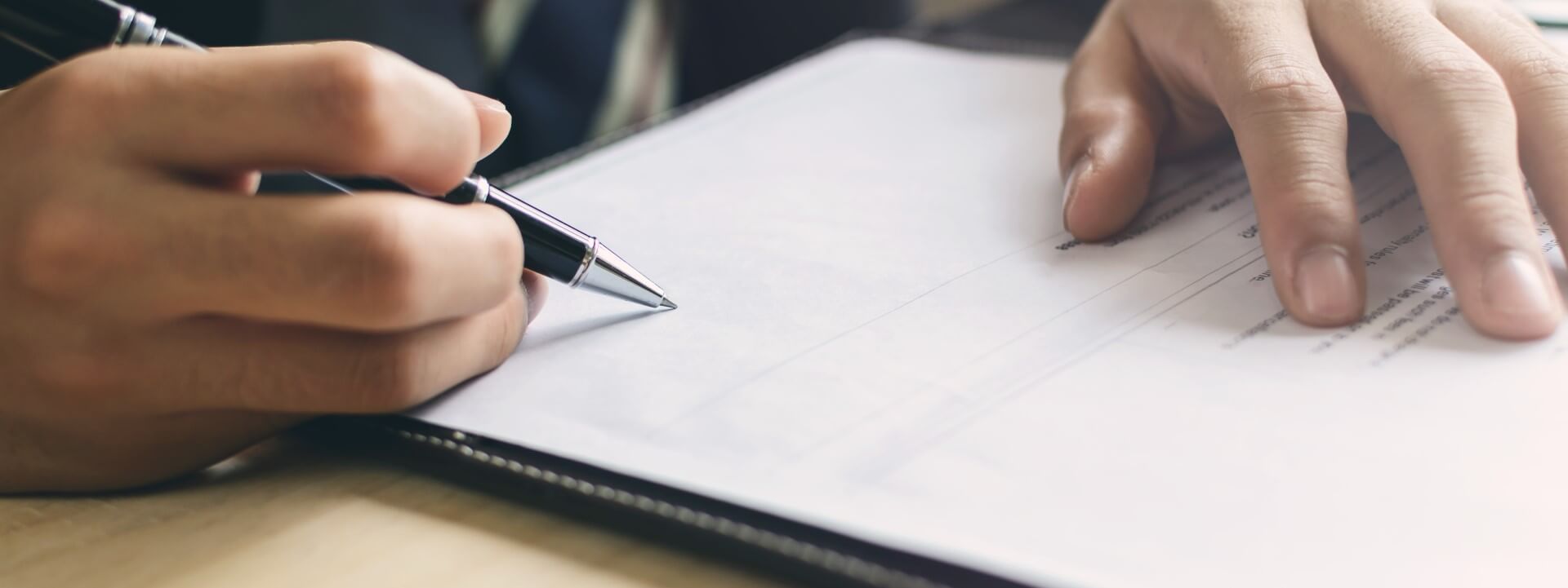 Image of a medical management specialist taking notes for a Primary Care Physician near northern Alabama.